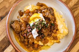 Braised pork with polenta, salsa verde and a poached egg - Photo: Hailey Bollinger