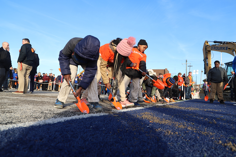Children from the West End dig up the first shovels of dirt at the groundbreaking ceremony for FC Cincinnati's coming soccer stadium - Nick Swartsell