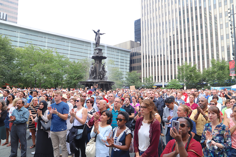 Hundreds attended a vigil for victims on Fountain Square the day after shootings at Fifth Third's downtown headquarters killed three and injured two - Nick Swartsell