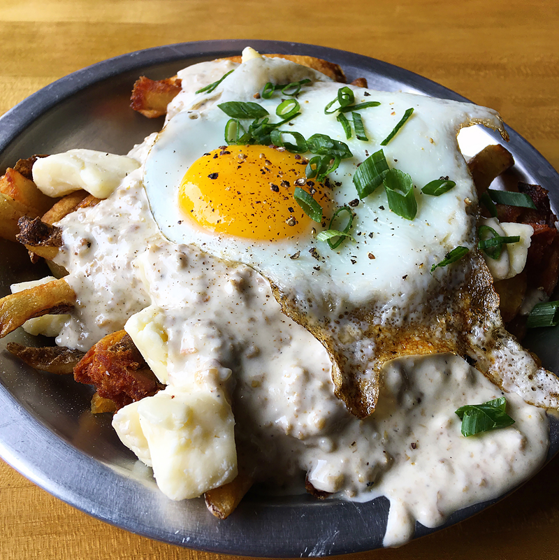 Northside Yacht Club's Breakfast Poutine — Kennebec fries, goetta gravy, Wisconsin cheese curds, scallions and a fried cage-free egg. - Photo: Sean Peters