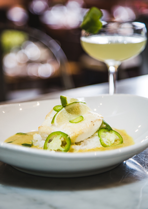 8 & E’s menu offers innovative seafood-centric fare, like baked halibut with coconut curry. - Photo: Hailey Bollinger