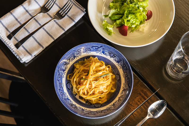 Tagliolini with crab prosecco fondue and a tomato tarragon broth and - a salad with strawberries - Photo: Hailey Bollinger