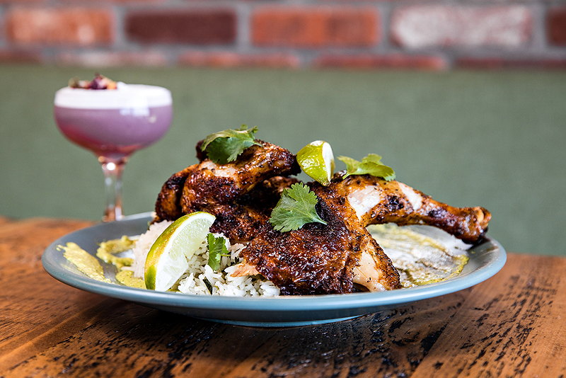 Pollo a la brasa dish and Rosie the Riveter cocktail from Revolution Rotisserie - PHOTO: HAILEY BOLLINGER