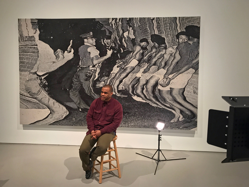 Noel Anderson in front of his monumental tapestry “die Leitung” in "Blak Origin Moment." - Photo: Courtesy of the Contemporary Arts Center