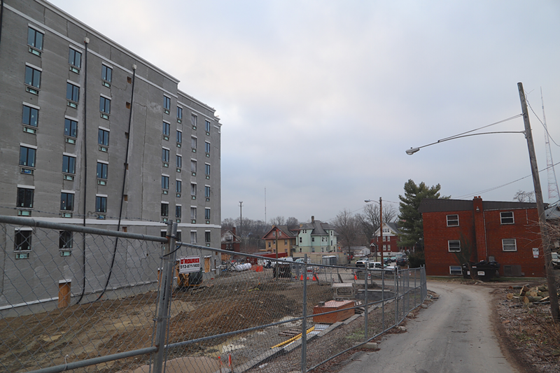A new hotel under construction next to an apartment building on Burnet Ave. in Mount Auburn. Residents of the apartments were given a 30-day notice to leave at the end of December. - Nick Swartsell