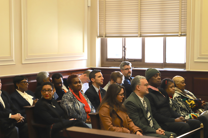 Conservative activist Mark Miller (front row, second from left) and council member P.G. Sittenfeld (second row, center) sit in Hamilton County Common Pleas Court. - NICK SWARTSELL