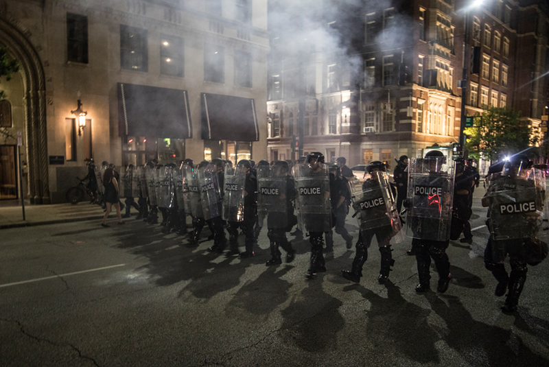Cincinnati Police march down Central Parkway on the first night of the city's George Floyd protests. - Nick Swartsell