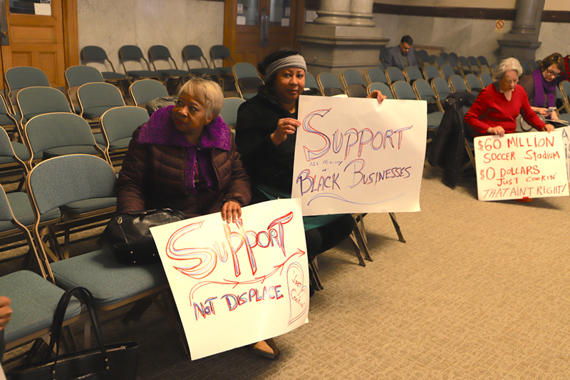 Monica Williams, center, sits with supporters at Cincinnati City Council's Budget and Finance Committee - Photo: Nick Swartsell