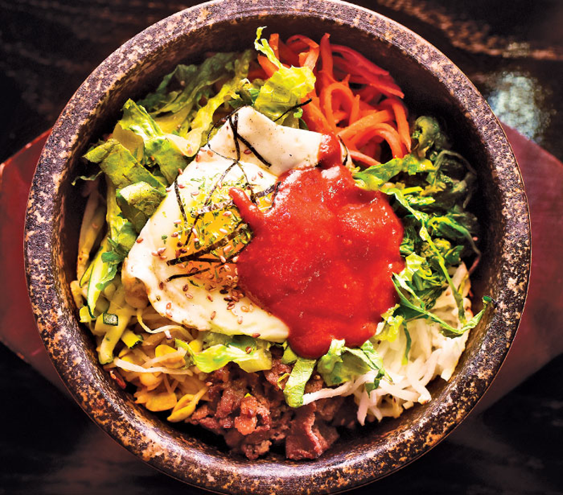 Hyde Park’s new 3501 Seoul serves up classic Koeran dishes like bibimbap, either fresh — with raw fish over steamed rice — or in a sizzling stone bowl. - Photo: Jesse Fox
