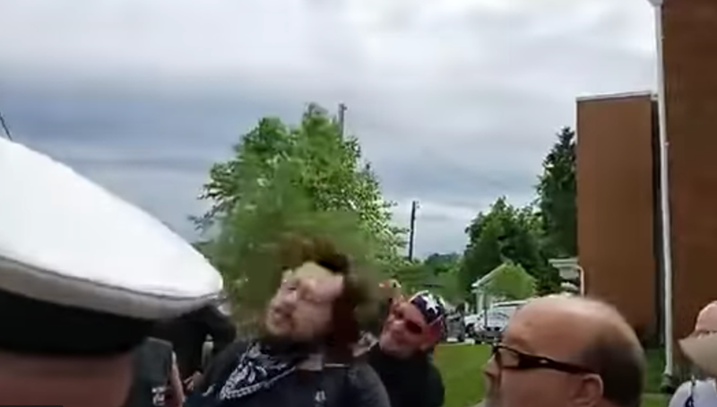 Black Lives Matter protester being punched in the back of the head - Film still from viral video