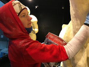 Tammy Buerk puts the finishing touches on the iconic butter cow sculpture, an attraction that has been a mainstay at the Ohio State Fair since the early 1900s. - Photo: Provided