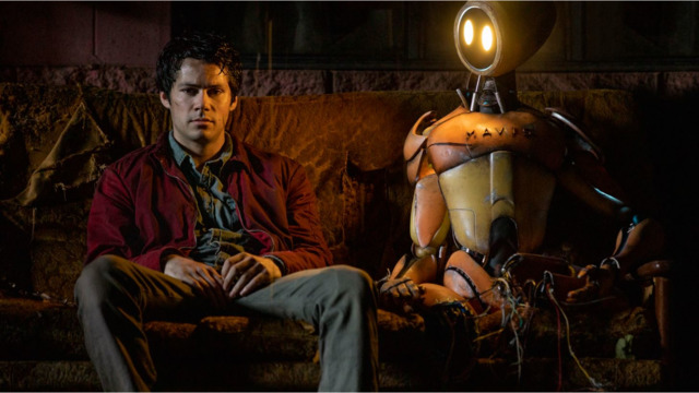 Joel (Dylan O'Brien) is dealing with the end of the world, the death of his parents and the loss of his love. But at least he has a companion robot to keep him company. - Photo: Paramount Pictures