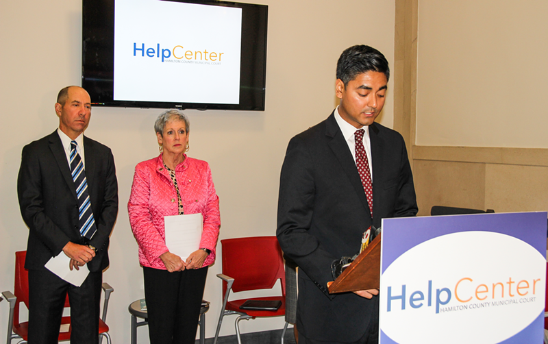 Hamilton County Clerk of Courts Aftab Pureval in front of Ohio Supreme Court Chief Justice Maureen O'Connor and presiding Hamilton County Municipal Court Judge Brad Greenberg - PHOTO: JAMES McNAIR