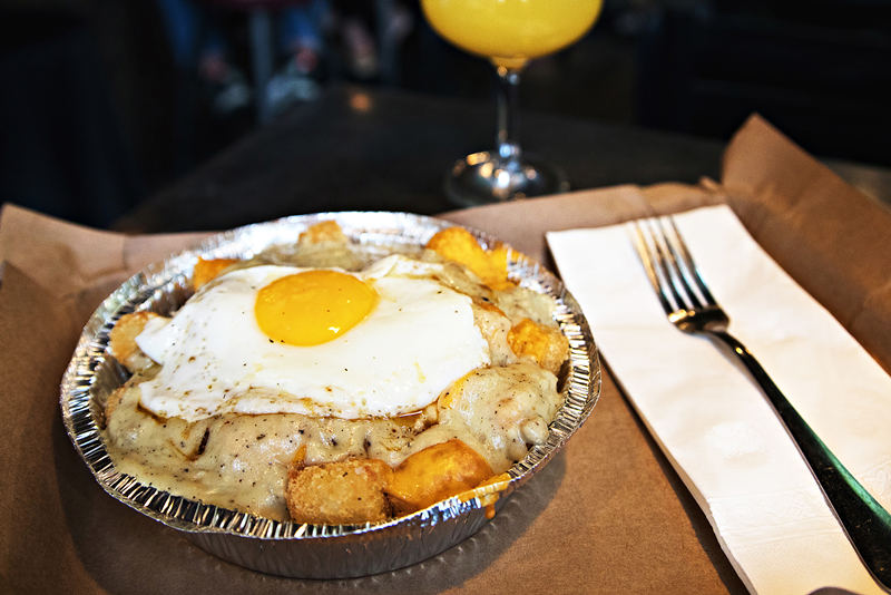 Nation's Breakfast Tots — tater tots, cheddar cheese, sausage gravy and a fried egg. - Photo: Brittany Thornton