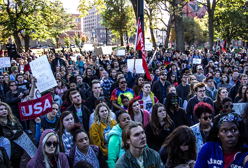Protesters in Washington Park following a march through downtown and Over-the-Rhine. Racial justice activists decrying a mistrial in the Ray Tensing case and anti-Trump demonstrators joined together for the march. - Nick Swartsell