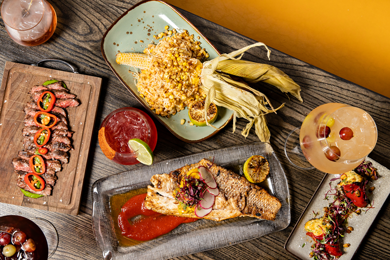 (Clockwise from left): A selection of dishes including skirt steak with chimichurri, elote, stuffed peppers with crab and Baja snapper - PHOTO: HAILEY BOLLINGER