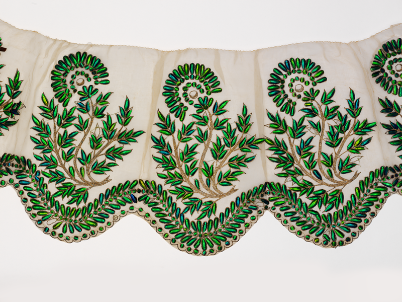 "Border  for  a  Dress"  made with cotton  muslin  and embroidered in beetle  wing-cases  and  gilded  silver. - Given  by  Mrs.  Mary  Gordon,  ©  Victoria  and  Albert  Museum,  London