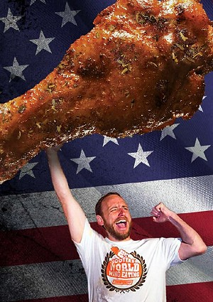 Joey Chestnut and a giant wing - Photo: hooters.com newsroom