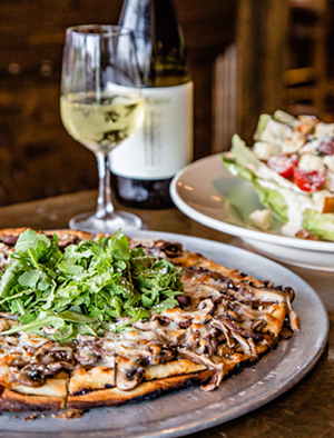The menu at Cork & Cap focuses on good wine and grilled pizza. - Photo: Hailey Bollinger