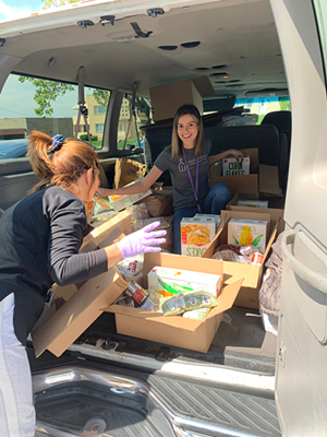 Su Casa workers packing food boxes - Photo: Catholic Charities of Southwestern Ohio