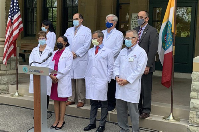 Columbus Public Health Commissioner Dr. Mysheika Roberts, flanked by physicians and health officials, speaks in front of the Franklin County Public Health building on Aug. 5, 2021. - PHOTO: JAKE ZUCKERMAN