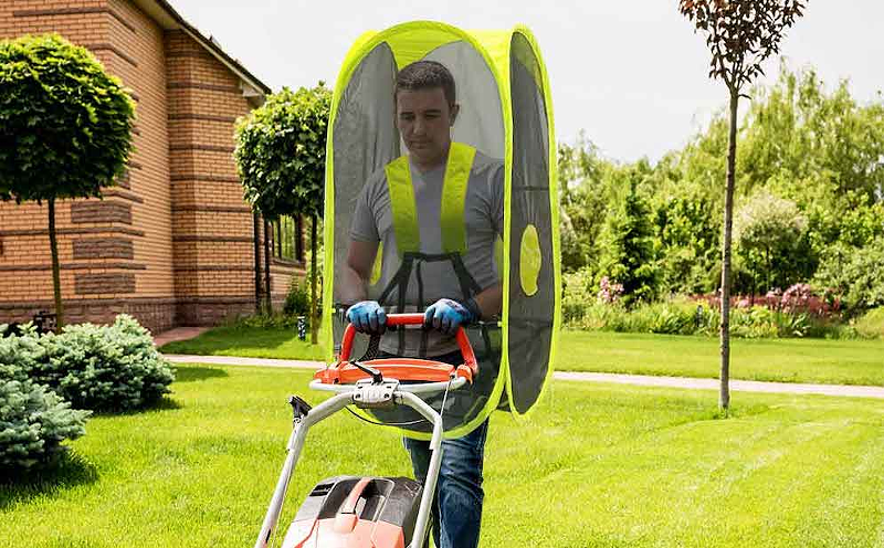 A guy mowing his lawn in a WalkingPod Mesh - PHOTO: UNDER THE WEATHER