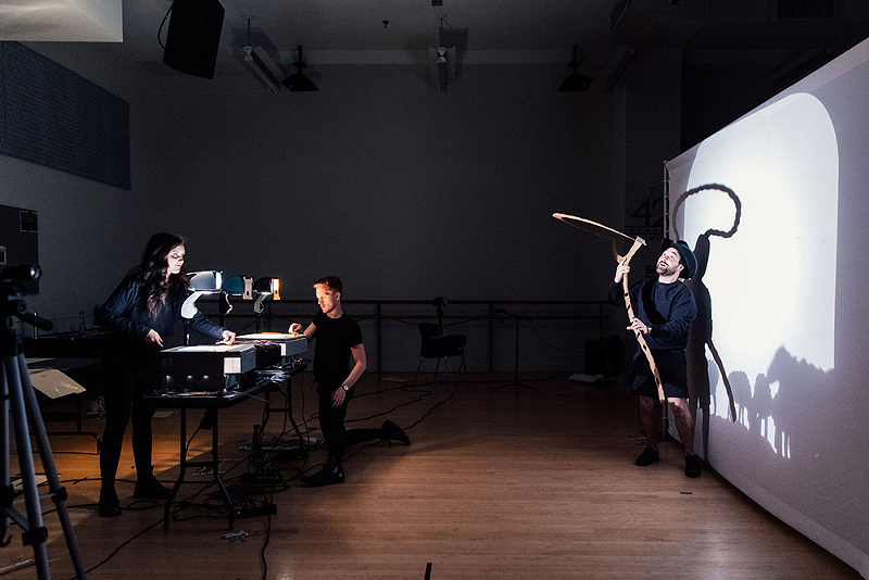 The video-on-demand production of Horsetale combines shots of what a theater audience would typically see, and then goes “backstage” to show how the performers manipulate the projectors to illustrate the story. - Photo: Marzio Fulfaro