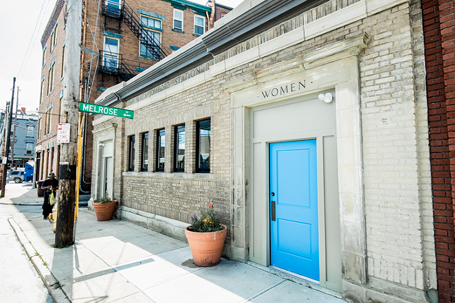 The exterior of Comfort Station — and its signature blue door — in Walnut Hills - PHOTO: HAILEY BOLLINGER
