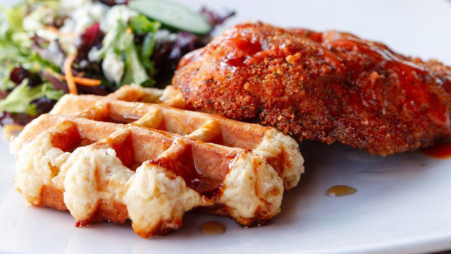 Taste of Belgium chicken and waffles served with a side salad. - Photo: Taste of Belgium