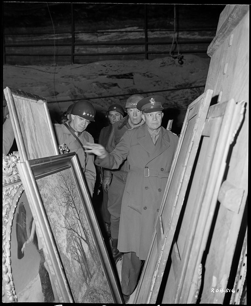 Generals Dwight D. Eisenhower, Omar N. Bradley, and George S. Patton inspect art found in the Merkers salt mine, April 12, 1945. - Photo: Courtesy of National Archives at College Park, MD