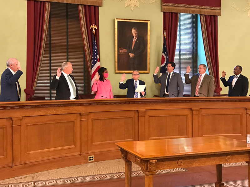 Members of the Ohio Redistricting Commission are sworn in at the Ohio Statehouse. From left, Senate President Matt Huffman, state Auditor Keith Faber, House Minority Leader Emilia Sykes, Gov. Mike DeWine, Secretary of State Frank LaRose, House Speaker Bob Cupp and Sen. Vernon Sykes. - Photo: Susan Tebben