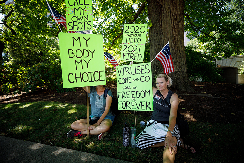 Protesters outside an Aug. 24 hearing at the Ohio Statehouse on legislation that would outlaw the practice from employers. - Photo: Graham Stokes