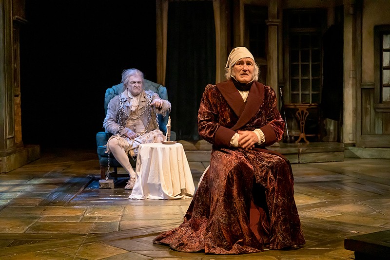 Ebenezer Scrooge (Bruce Cromer, in the foreground) and Jacob Marley (Greg Procaccino) in the 2021 production of A Christmas Carol at Cincinnati Playhouse in the Park - Photo: Mikki Schaffner Photography
