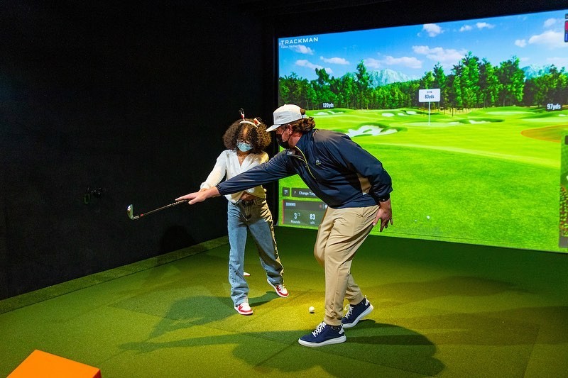 Five Irons Golf indoor golf simulator. - PHOTO: FACEBOOK.COM/FIVEIRONGOLF