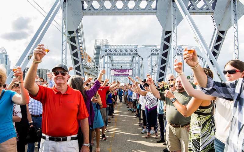 An image of the 2018 "World's Biggest Bourbon Toast" on the Purple People Bridge to celebrate the release of New Riff Distilling's first batch of bourbon. - PHOTO: HAILEY BOLLINGER