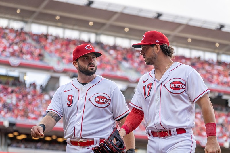 Cincinnati Reds infielder Mike Moustakas (left) chats with shortstop Kyle Farmer. - Photo: Ron Valle