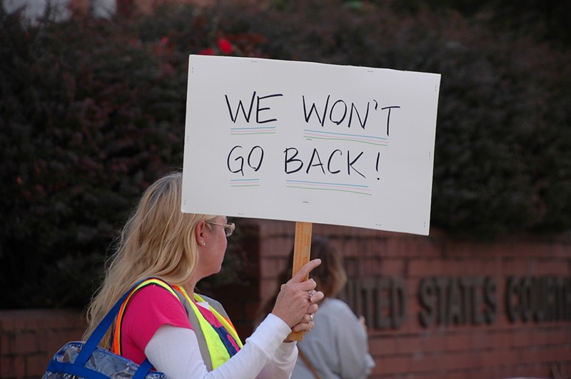 A protester joins a pro-choice rally in Covington on Oct. 8. Demonstrators want Kentucky and Ohio abortion law to be expanded in lockstep. - Photo: Sean Peters