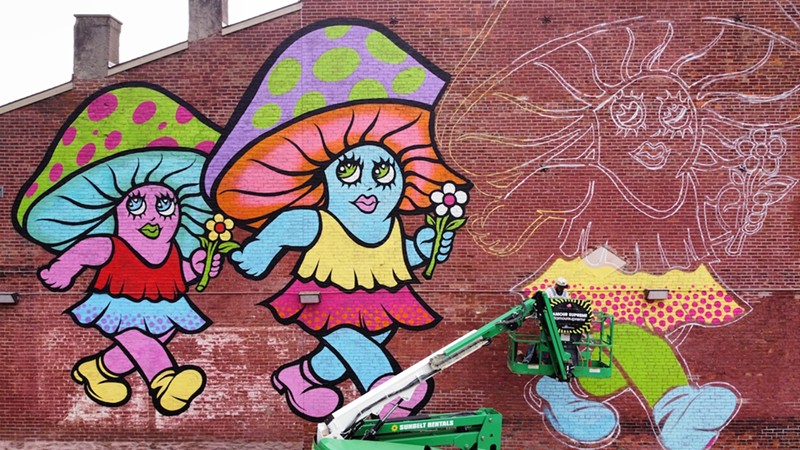 L'amour Supreme works on his Ma Jolie mural in OTR ahead of BLINK in 2022. - Photo: provided by Arnold's Bar and Grill