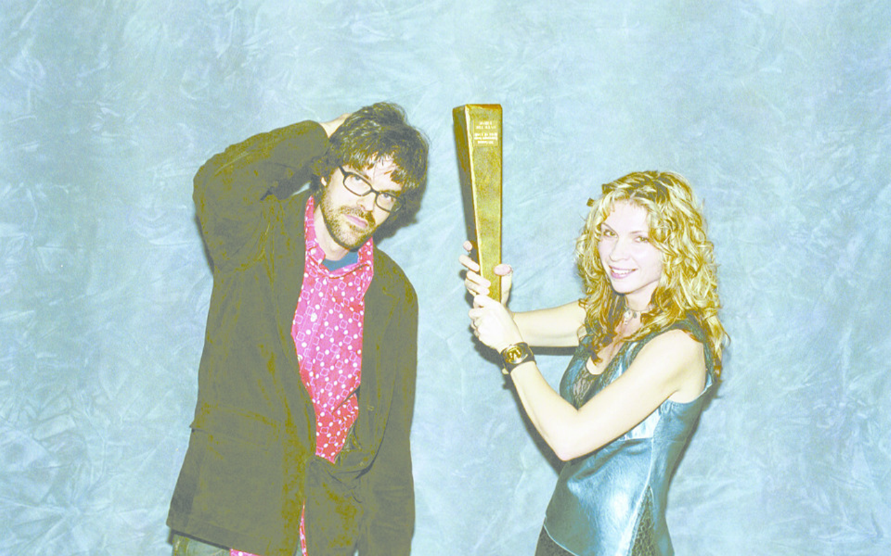 Linford Detweiler and Karin Bergquist with Over the Rhine's CEA Hall of Fame trophy in 2003