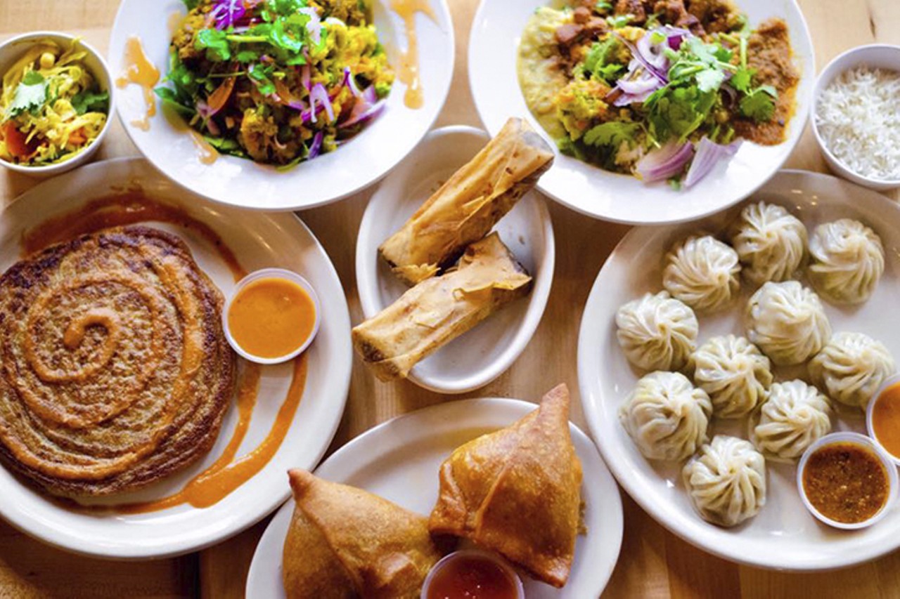 Bridges Nepali Cuisine Elmwood
6304 Vine St., Elmwood
People of Elmwood Place, rejoice: Bridges Nepali Cuisine announced it's going to open a third location in the neighborhood.
"Bridges is excited to open its third location to serve the beautiful elmwood neighborhood!!! We will be open soon! Thank you for your love and support," the restaurant wrote in an Instagram post. The post shows a photo of owners Ashak Chipalu and his parents, Rose and Manoj, embracing in front of the new location at 6304 Vine Street, formerly occupied by Mikey's Kitchen. No opening date has been set, but CityBeat staff hungrily await Bridges' newest location in Elmwood.