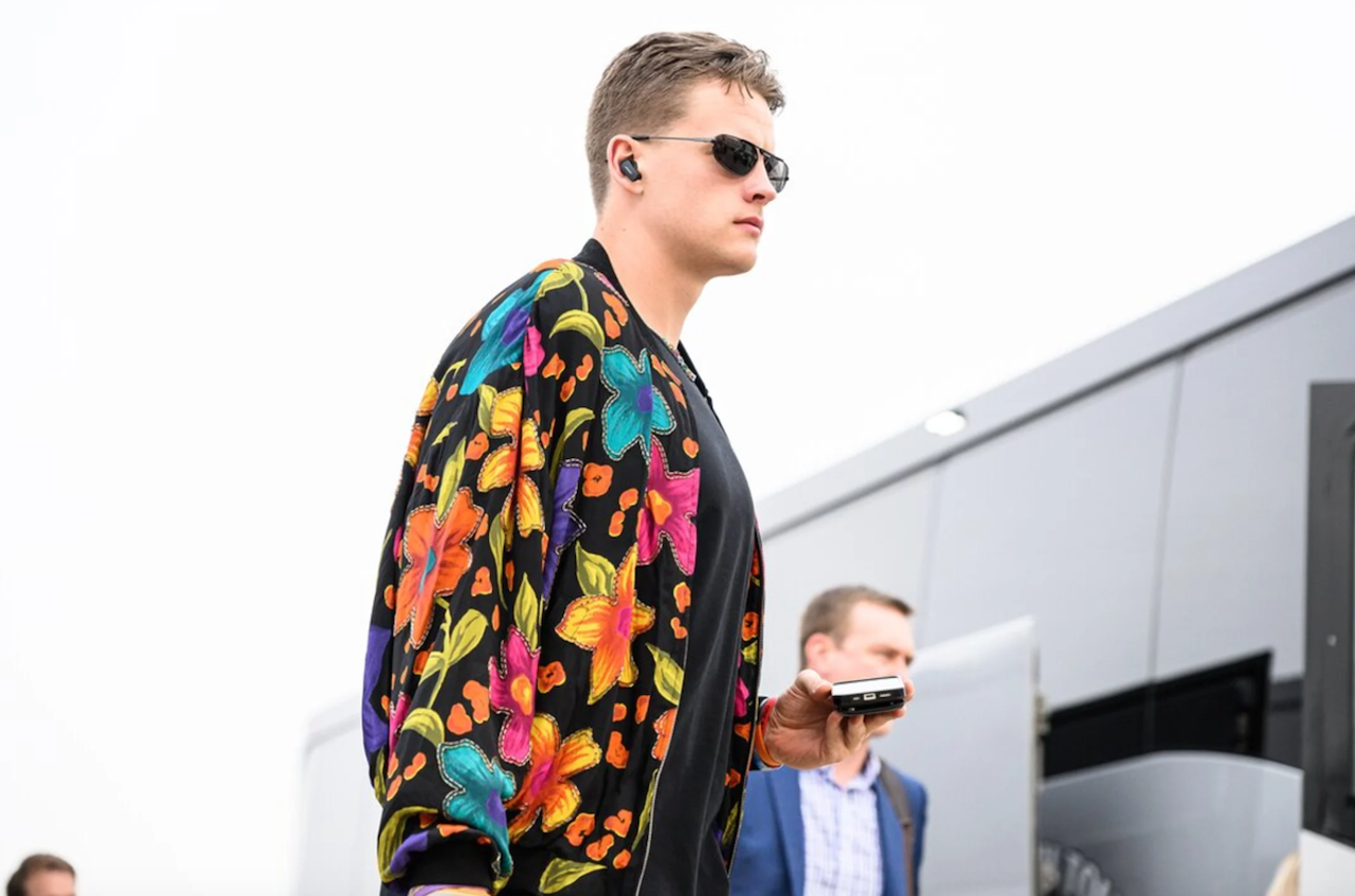 Cincinnati Bengals quarterback Joe Burrow wears a multicolored jacket before the game against the Tennessee Titans on Nov. 27, 2022.