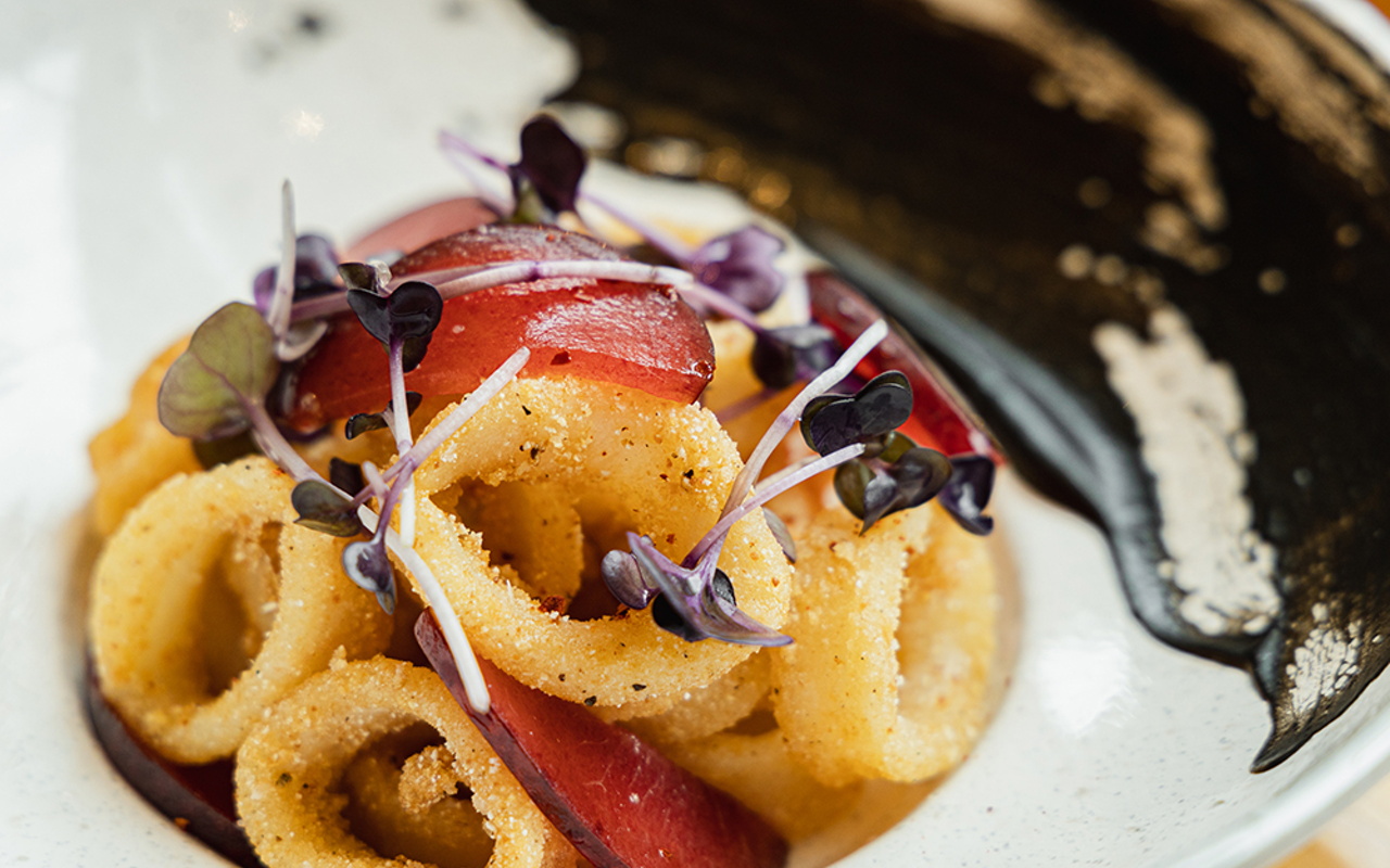 Cornmeal-crusted calamari with pickled plums and radish sprouts