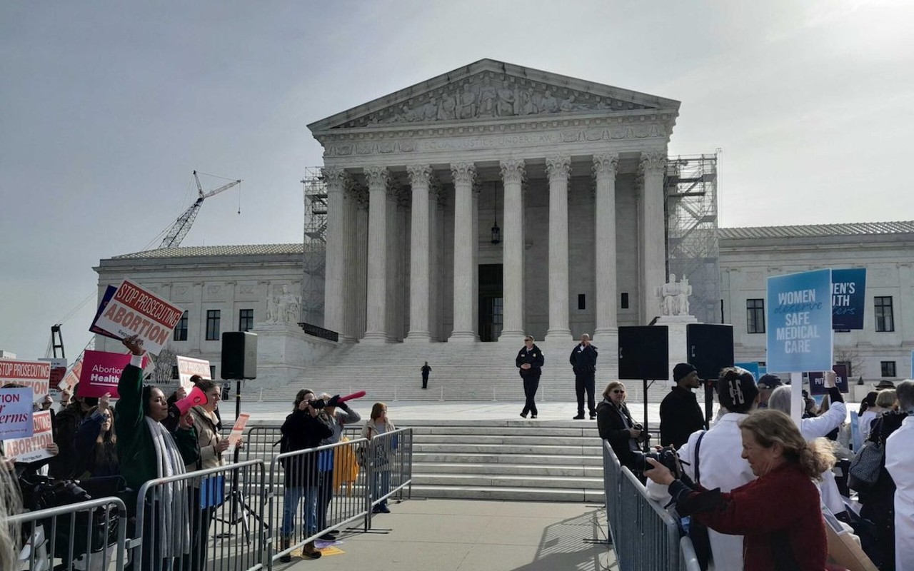 Opposing protesters outside of the U.S. Supreme Court on Tuesday, March 26, 2024, are kept separated by fencing as U.S. Capitol Police and Supreme Court Police observe. The demonstrators held signs and chanted as the justices heard oral arguments over access to mifepristone, one of two pharmaceuticals used in medication abortion.