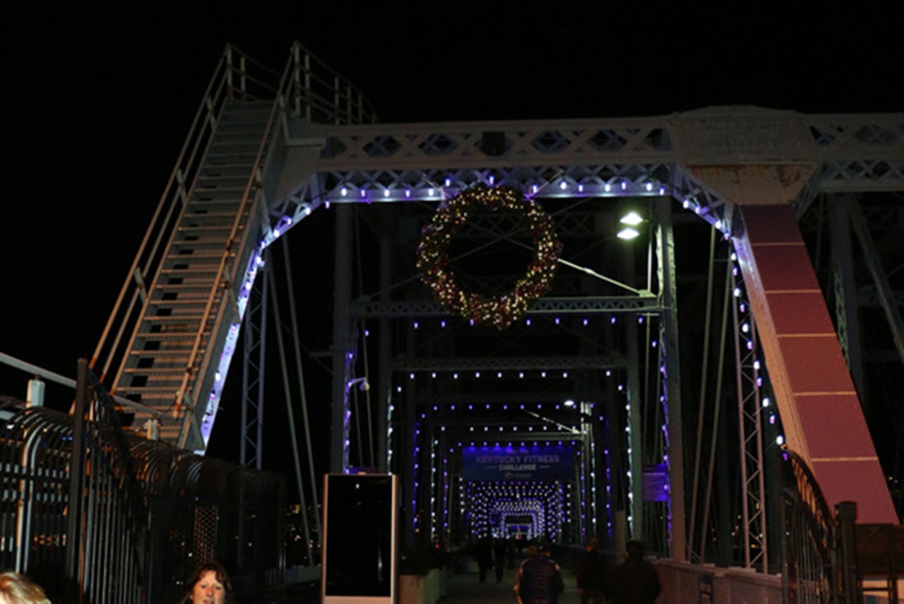 Winter Nights, River Lights on the Purple People Bridge
425 York St., Newport
Kicking off Friday, Nov. 20, Winter Nights, River Lights will illuminate the pedestrian bridge with 1,000 purple-and-white lights, a 25-foot christmas "wish" tree, projections and seasonal music played over speakers spanning the bridge. Due to the pandemic, the Purple People Bridge venue was unable to host events, which typically contribute to funds used for holiday displays. Newport Southbank Bridge Company, which owns the bridge, typically spends about $10,000 annually for the holiday display. Because of the financial discrepancy, they had to make the difficult decision to cancel this year's light show. But a Christmas miracle ensued. North American Properties, the team behind Newport on the Levee's redevelopment, and some other local contributors stepped up to secure the funding for the illumination. The official tree lighting ceremony (which is not open to the public) will kick off at 6 p.m. on Nov. 20, and the display will be up through Jan. 15. 
Photo: Provided by Winter Nights, River Lights organizers