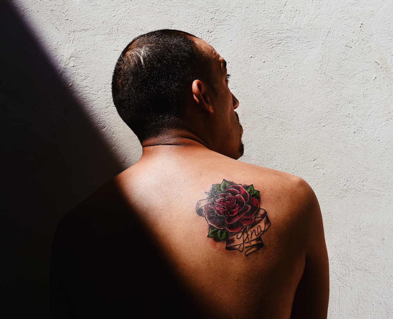This man got a rose tattoo for his mother. “A couple guys who had been in the United States and been involved in gangs there had been deported,” Becki says. “(He) is one of them. His mother lives in New York and he can’t see her. He’s not allowed to go back even though he’s working on turning his life around.”